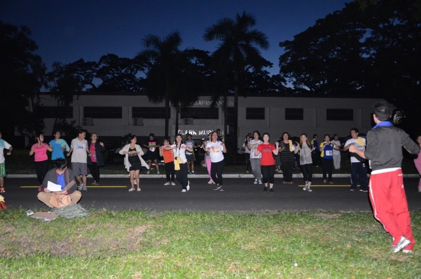 DILG R-3 personnel engage in Zumba exercise before the Fun Run
