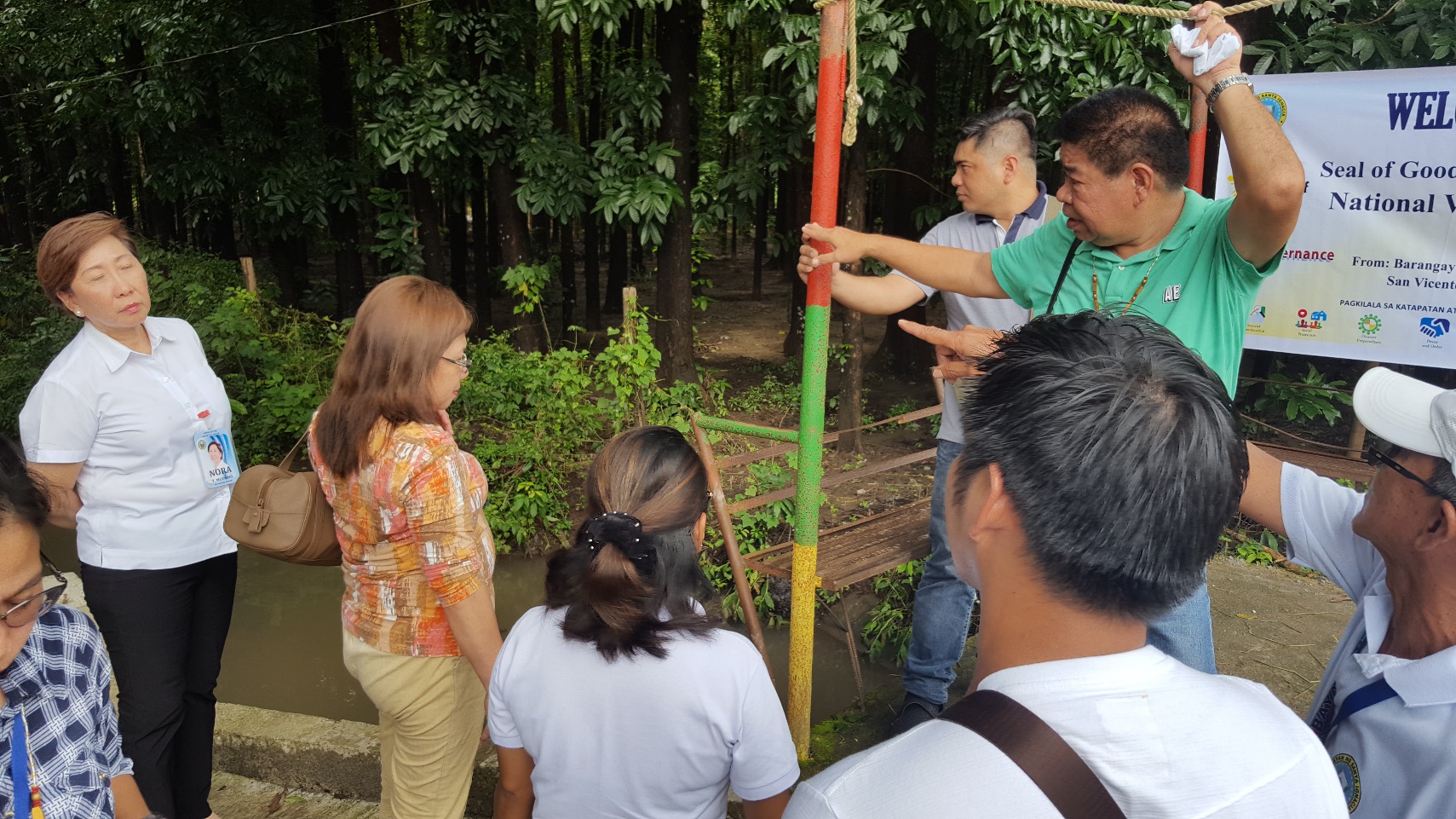 RESILIENCE. Validators from Region V check the flood markers located in one of the Barangays in Santa Ignacia during one of the scheduled SGLG Assessments. The presence of flood markers is one of the sub-indicators of the SGLG under Disaster Preparedness.
