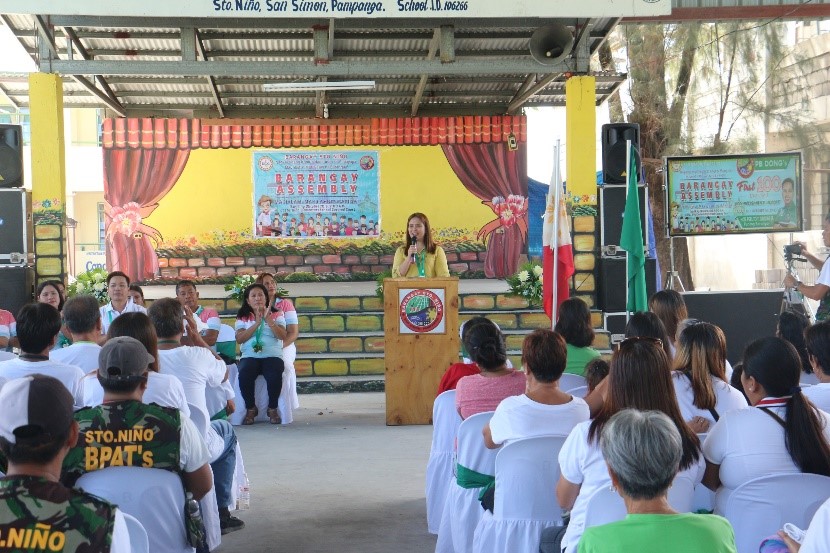 DILG Pampanga PD Myrvi Fabia delivers the message of DILG OIC Eduardo Año to the people of San Simon, Pampanga